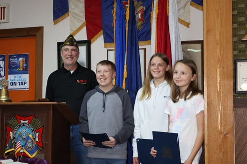 Pictured is VFW commander Garret with Malakai, Megan and Patricia.