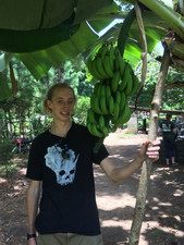 Student with a bunch of bananas.