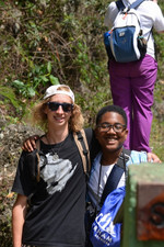 Students standing with their arms around each other.