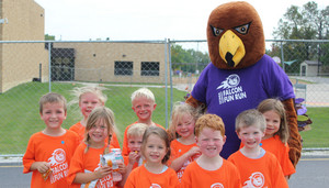 Students outside with school mascot